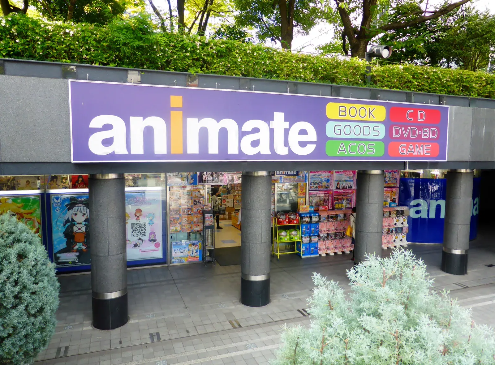 Animate anime shop entrance with blue sign and goods displays