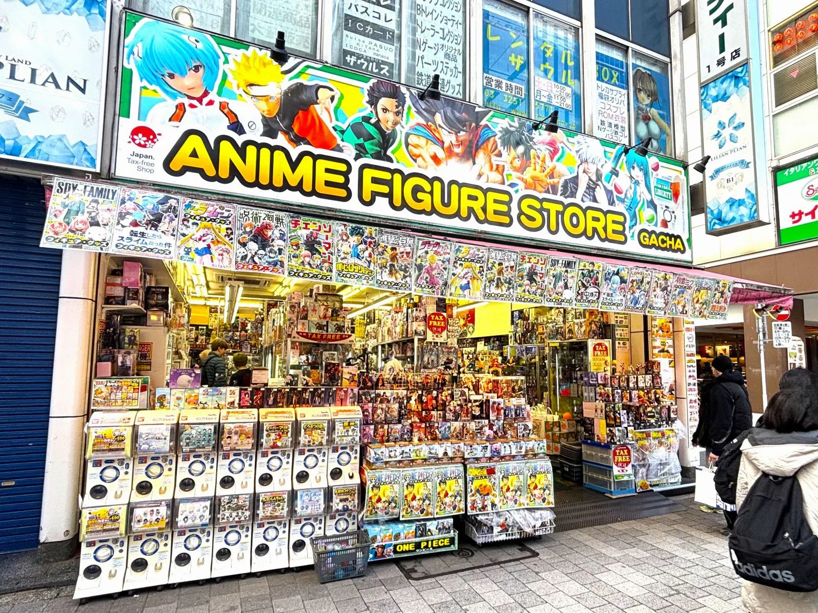 Anime figure store with gacha machines and colourful signs in Akihabara
