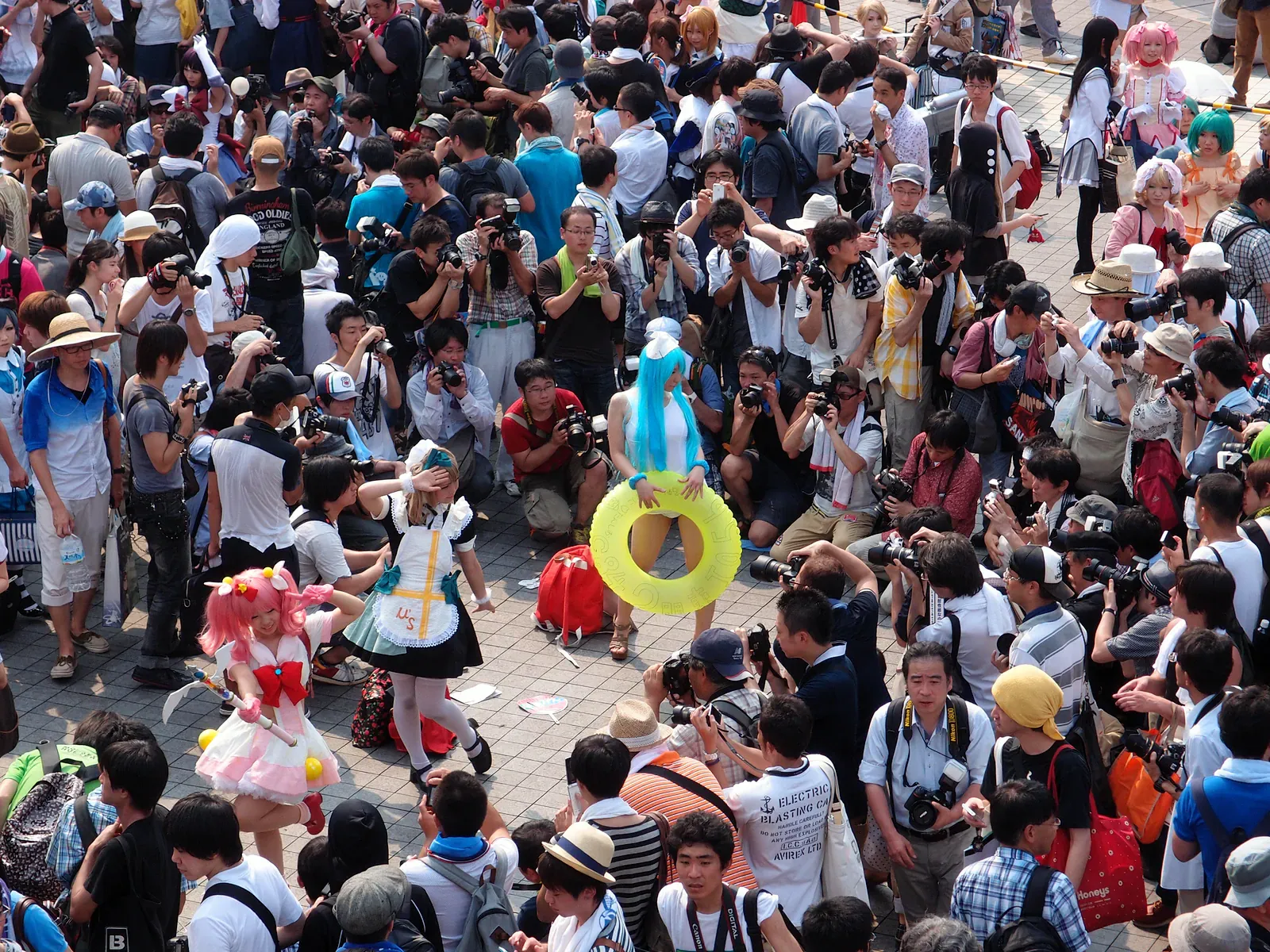 Dense crowd of visitors and cosplayers photographing outside Tokyo Big Sight