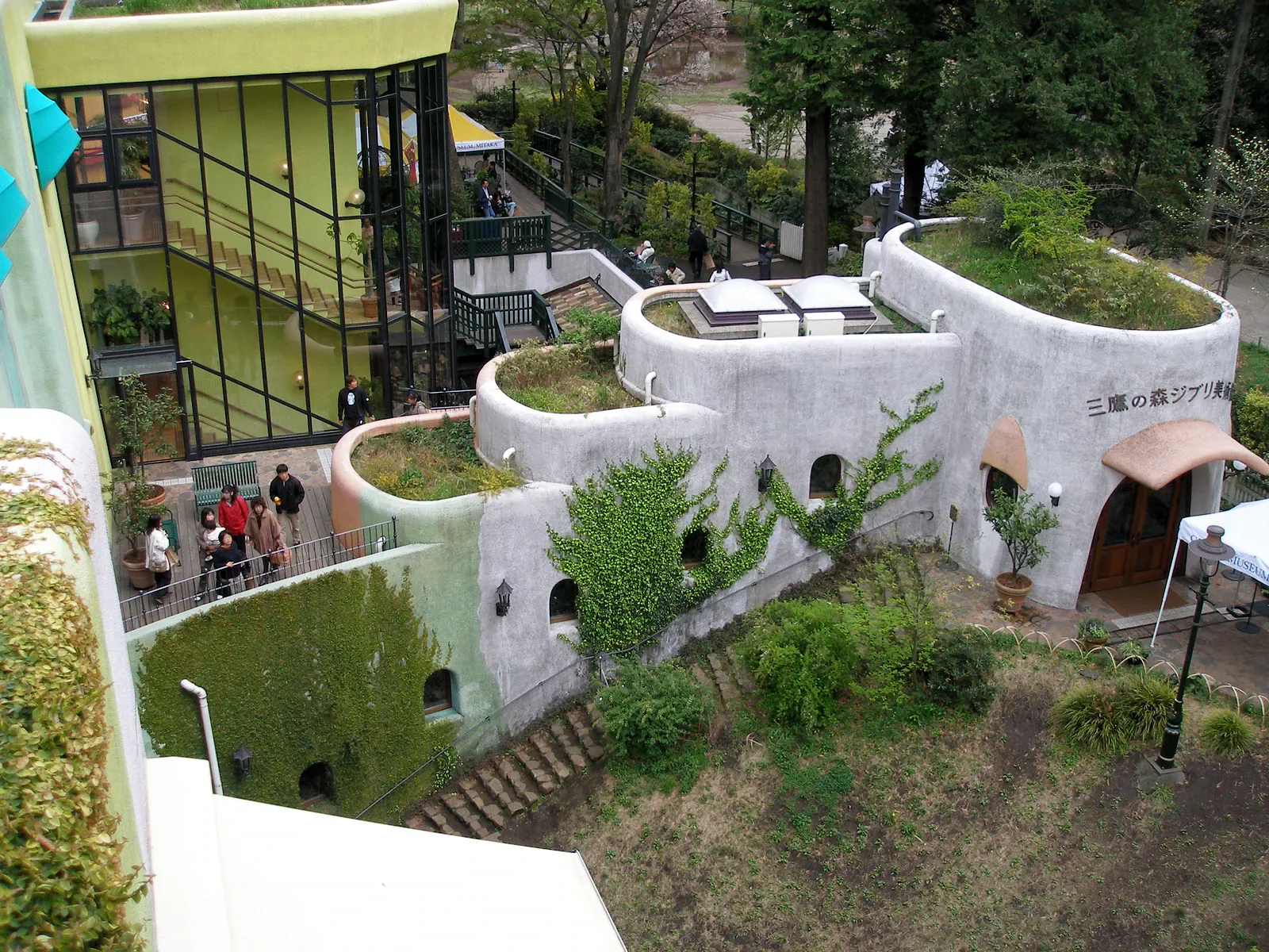 Rooftop garden with rounded white buildings and green roofs seen from above