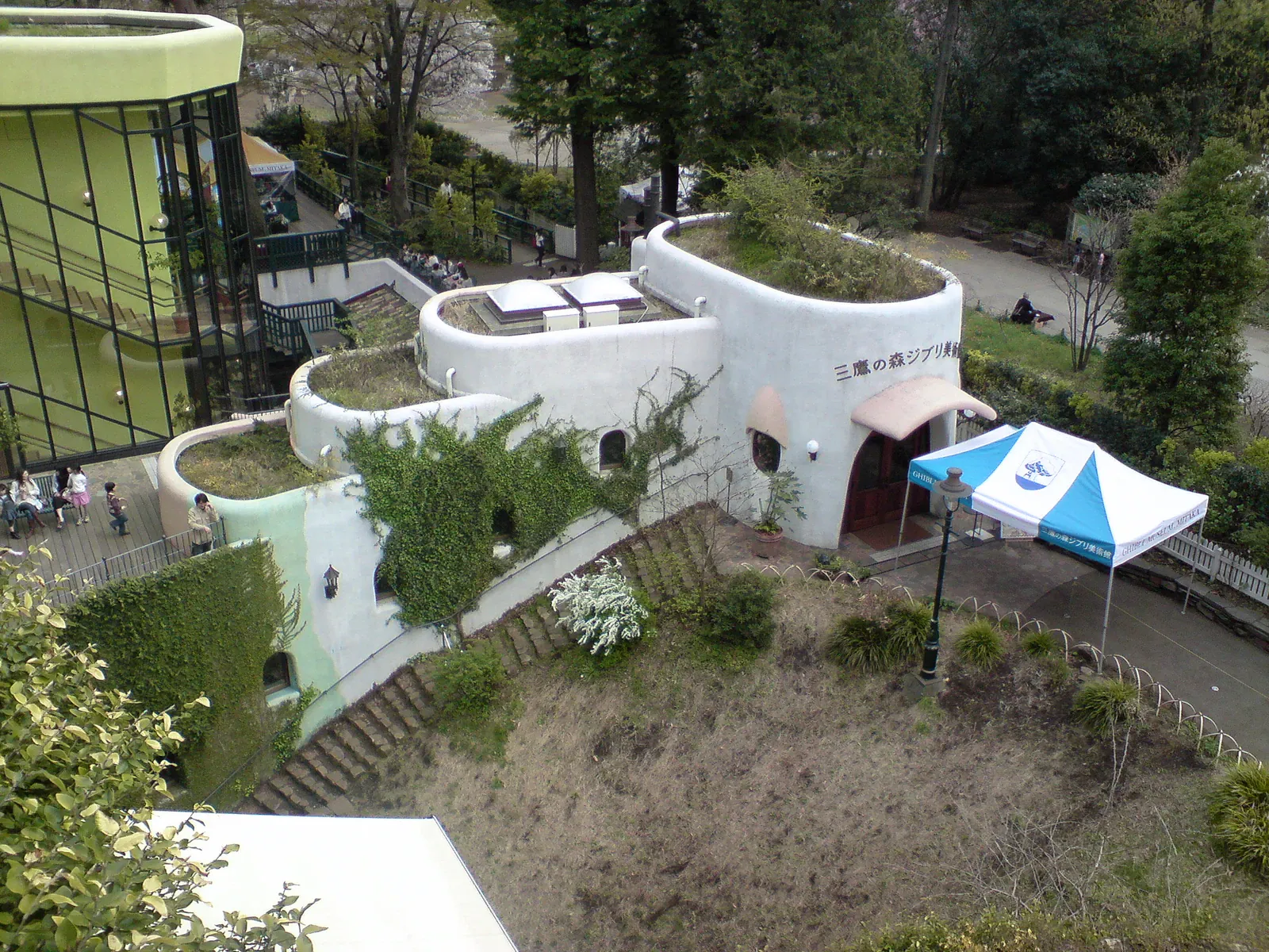 Rooftop garden with rounded white buildings and green roofs seen from above