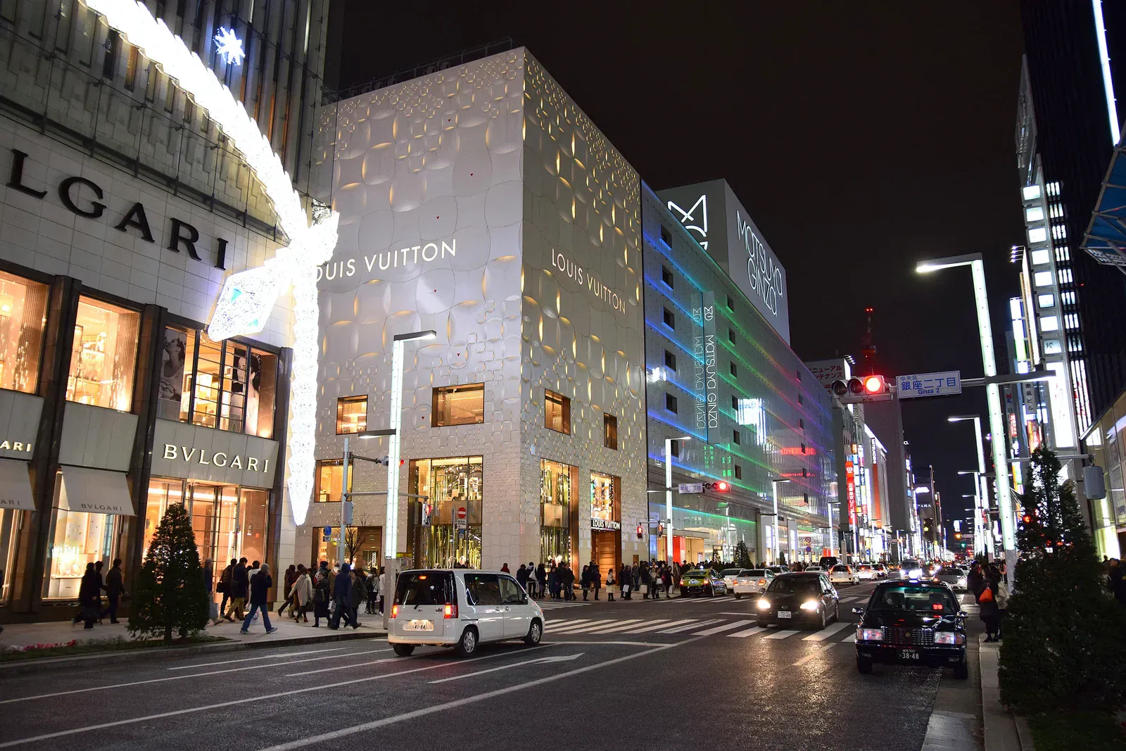Ginza street at night with Bulgari and Louis Vuitton stores