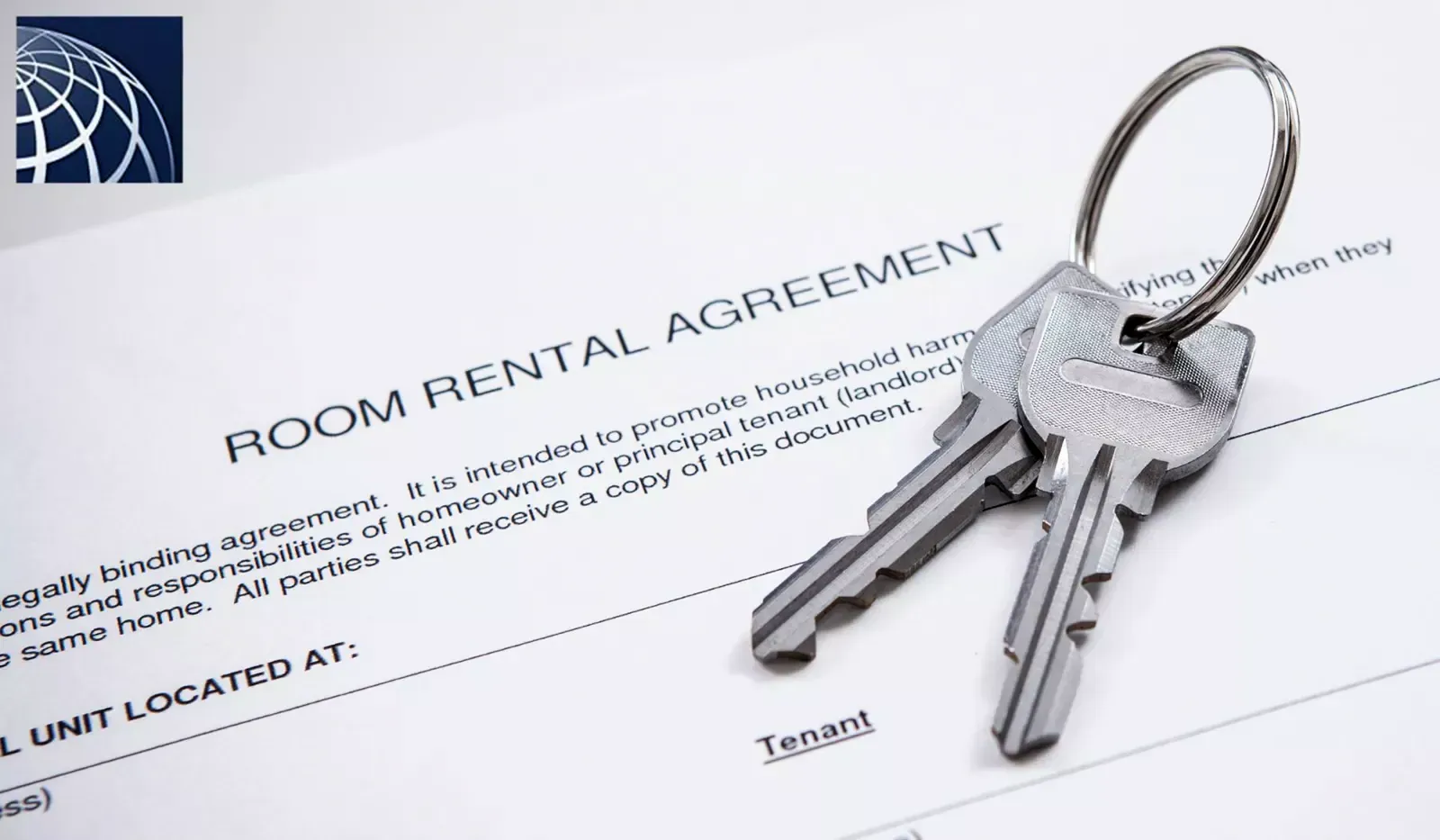 Pair of keys resting on a room rental agreement form