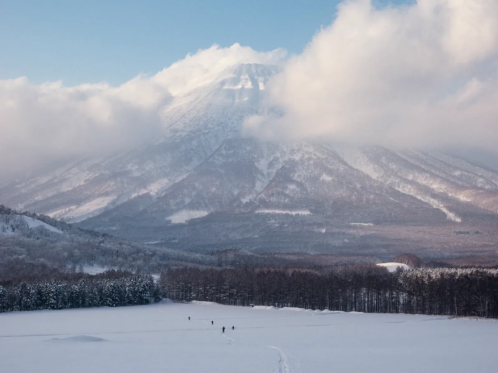 Snow-covered mountain under cloud