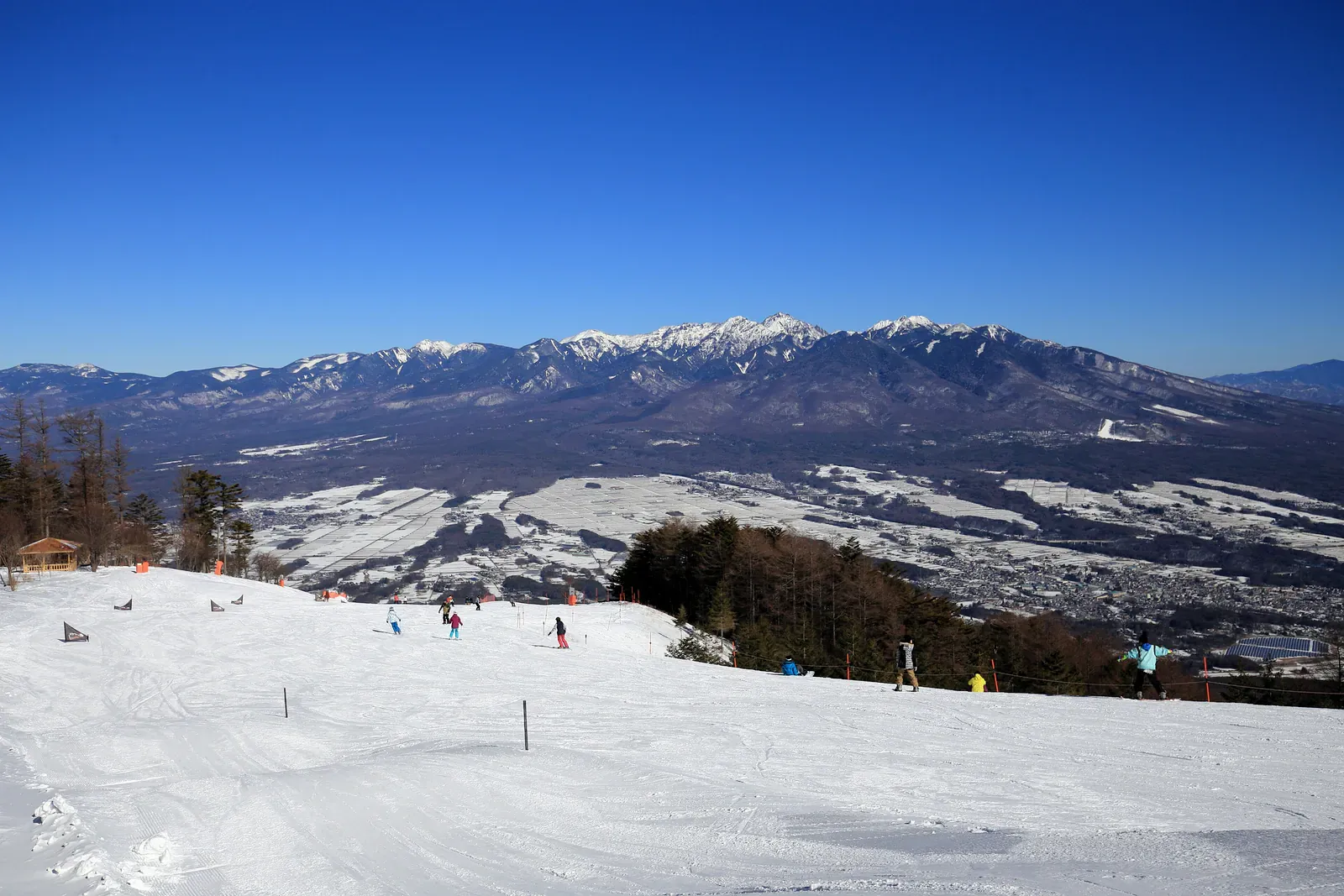 Snowy ski slope with mountain view in Japan