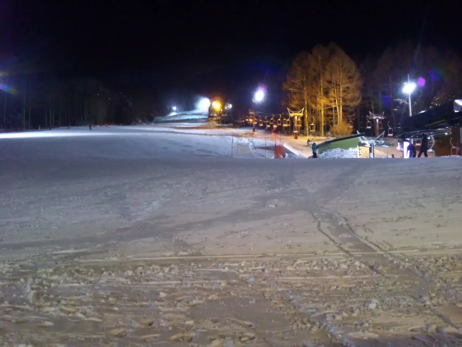 Floodlit ski slope at night