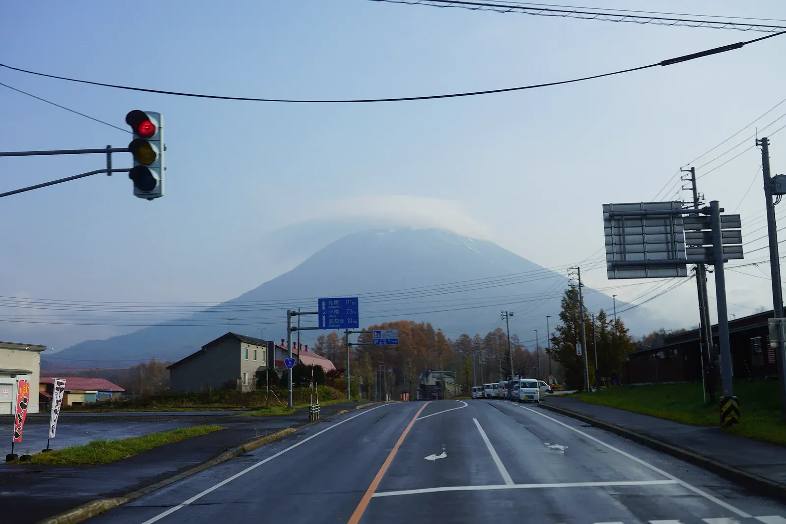 Road in Niseko with Mount Yotei behind