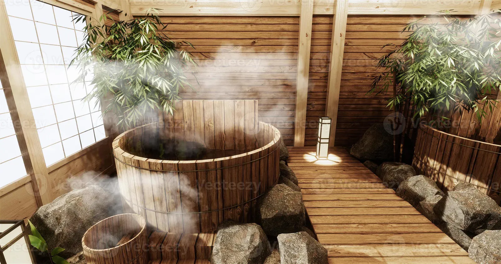 Steaming round wooden bathtub in a bamboo-screened garden bath