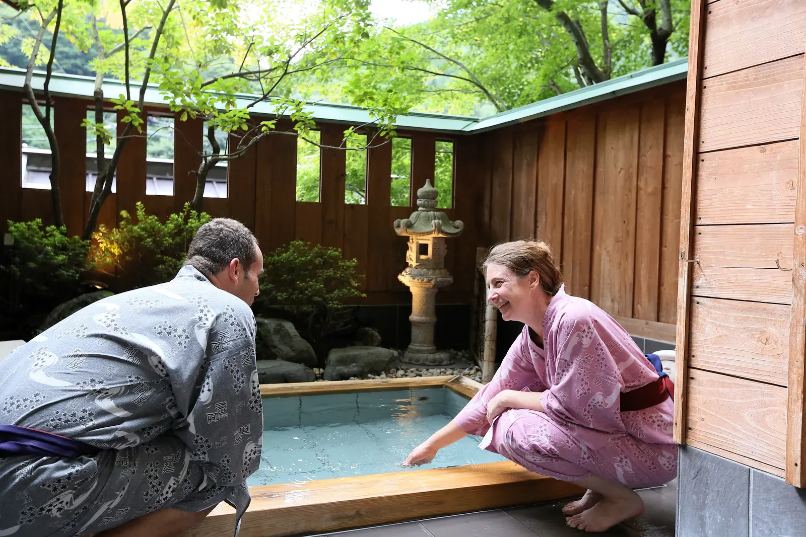 Ryokan room with a private open-air onsen bath