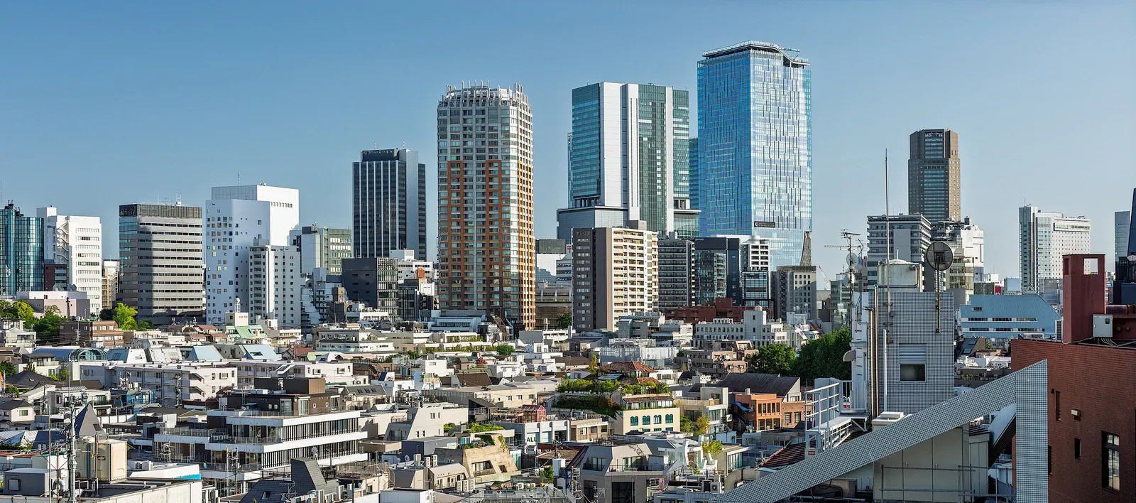 Glass towers rising above low-rise Tokyo neighbourhoods