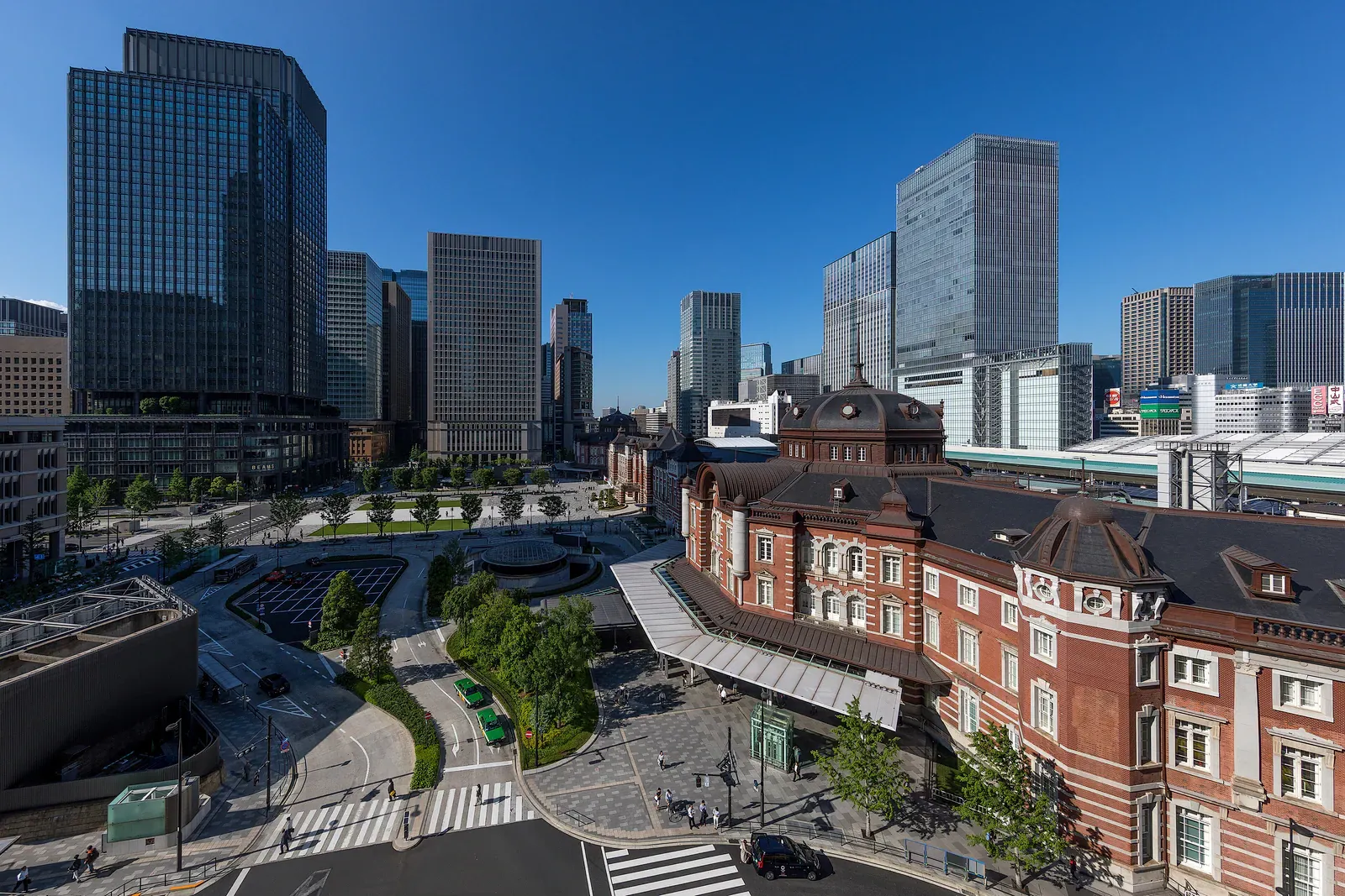 Red-brick Tokyo Station building with Marunouchi towers from above