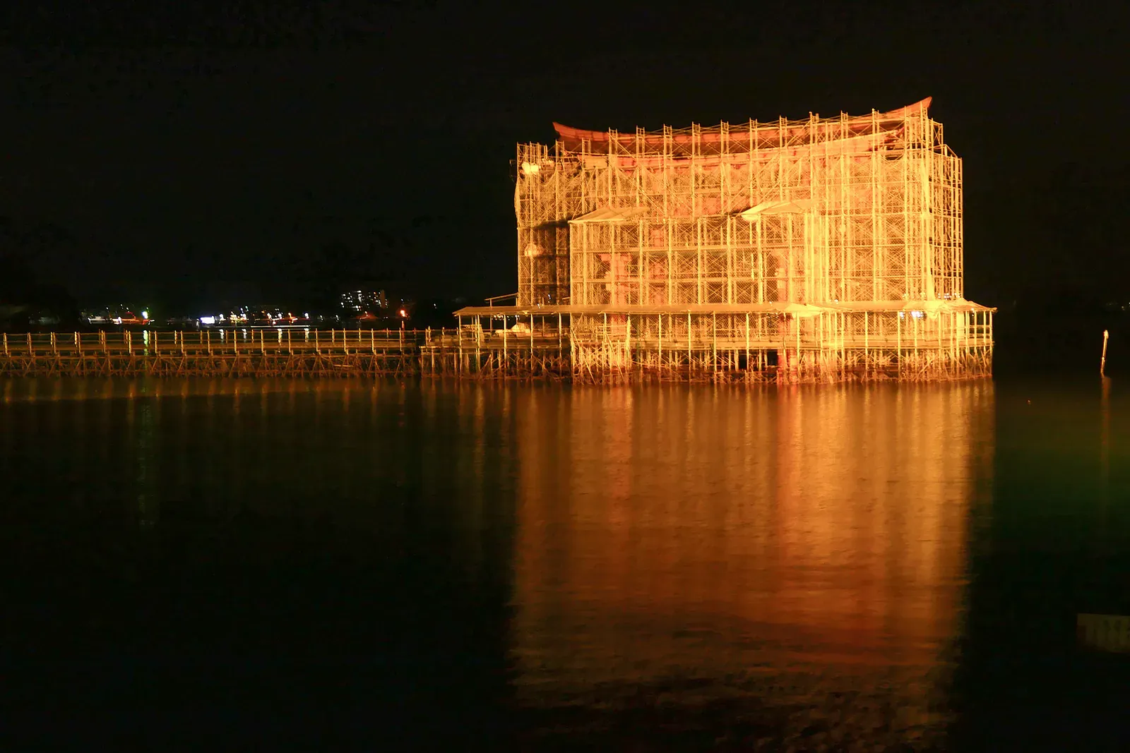 Itsukushima Shrine torii lit up at night